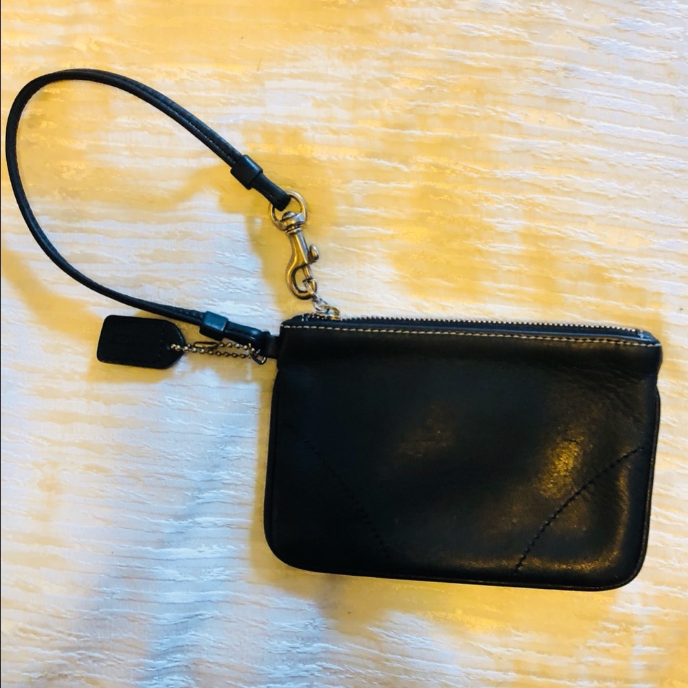 Coach black leather wristlet with silver accents
